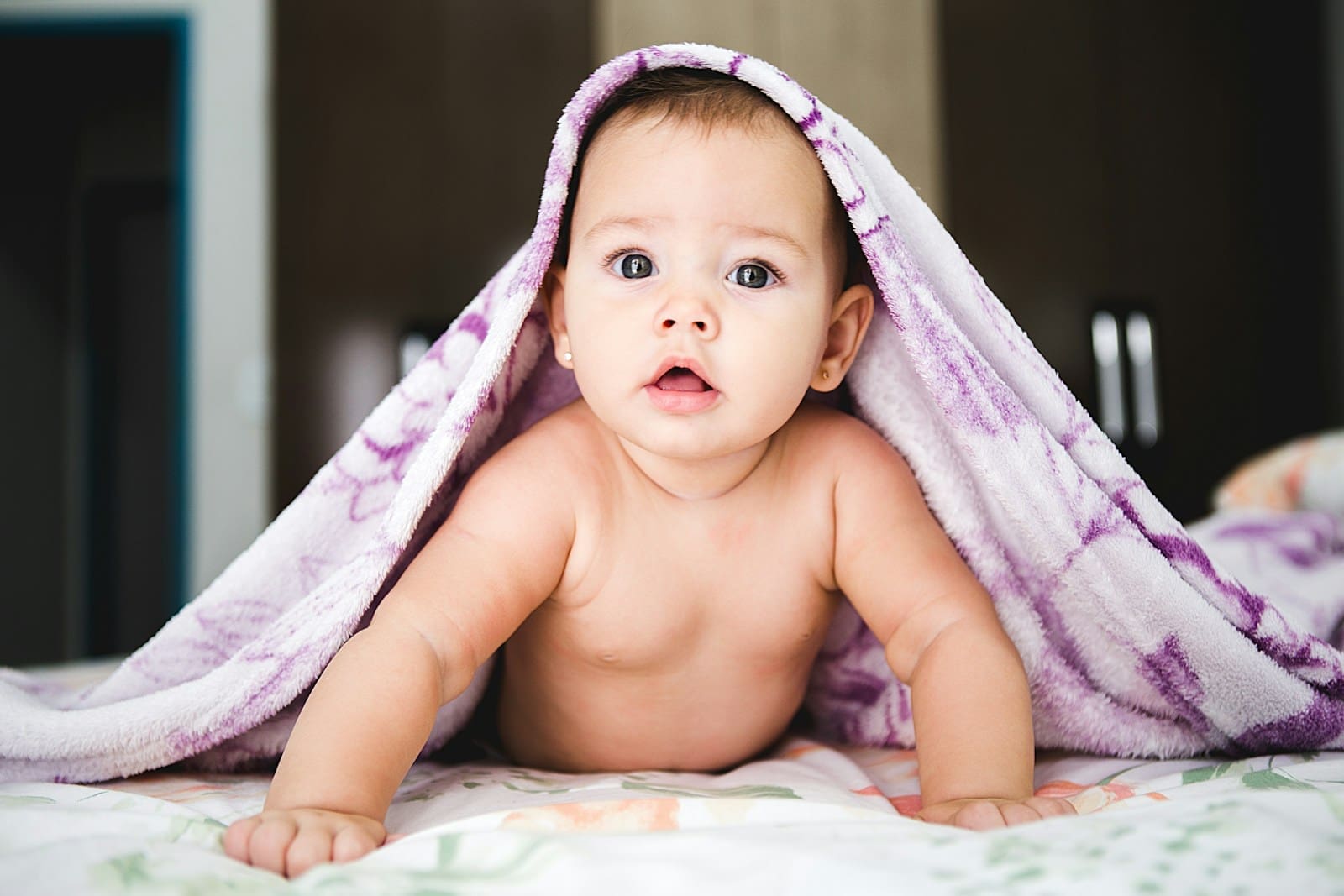 Photo by Jonathan Borba baby under purple blanket