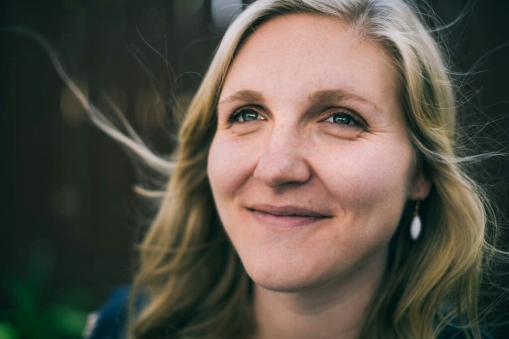 a close up of a middle aged woman with blonde hair