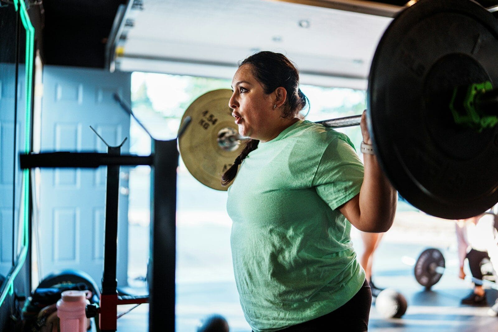 Photo by Land O’Lakes, Inc. Woman lifting weights in a gym. You don't necessarily need to supplement with creatine but it can be a support to your active lifestyle